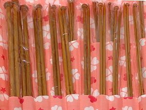 A set of 18 bamboo knitting needles. Sizes: 2 mm (US 0), 2.25 mm (US 1), 2.5 mm (US 1), 2.75 mm (US 2), 3 mm (US 3), 3.25 mm (US 3), 3.5 mm (US 4), 3.75 mm (US 5), 4 mm (US 6), 4.5 mm (US 7), 5 mm (US 8), 5.5 mm (US 9), 6 mm (US 10), 6.5 mm (US 10 1/2), 7 mm (US 10 1/2), 8 mm (US 11), 9 mm (US 13), 10 mm (US 15). Comes in a case. Brand Ice Yarns, acs-1254 
